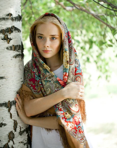 Beauty woman in the national patterned scarf — Stock Photo, Image