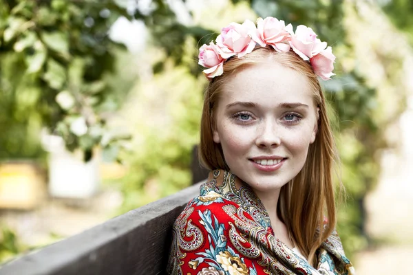 Beauty woman in the national patterned scarf — Stock Photo, Image