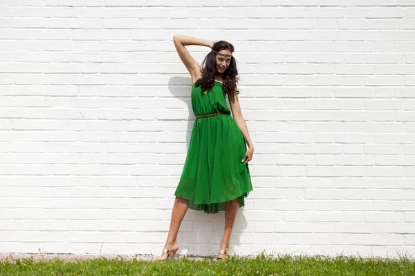 Beautiful young woman in green dress — Stock Photo, Image