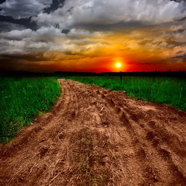 Ground road at sunset — Stock Photo, Image