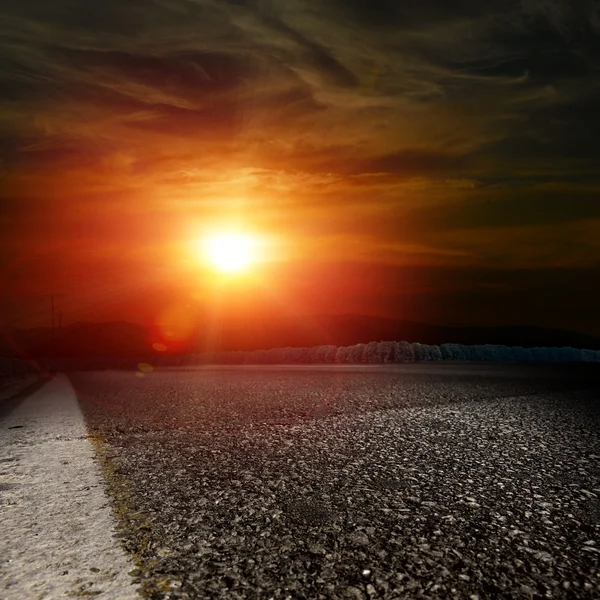 Asphalt road at sunset — Stock Photo, Image