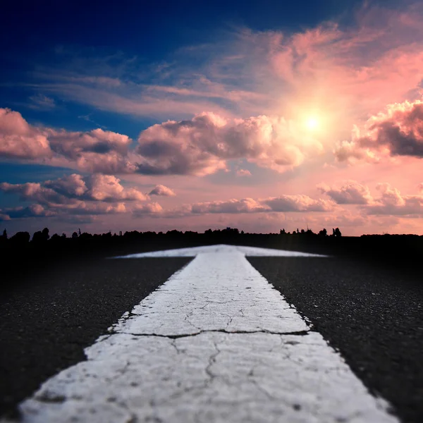 Asphalt road at sunset — Stock Photo, Image