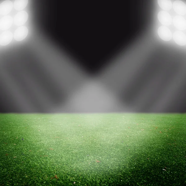 Campo de futebol com luzes brilhantes — Fotografia de Stock