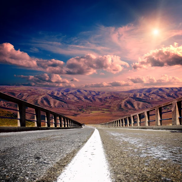 Asphalt road with mountians — Stock Photo, Image