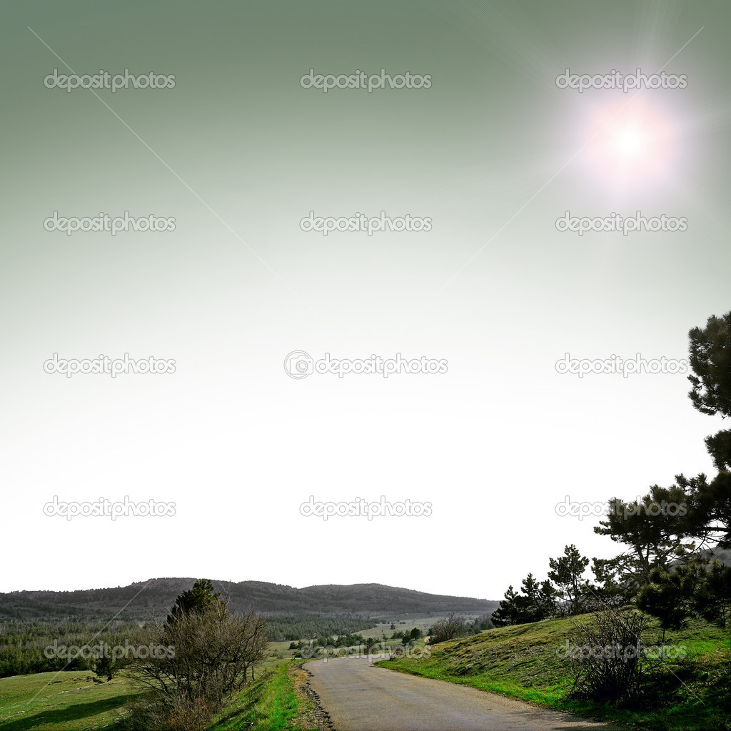 asphalt road with mountians