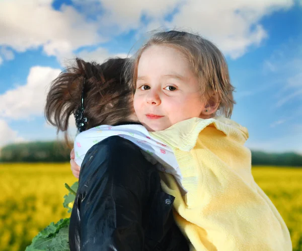 Little girl with mother on nature — Stock Photo, Image