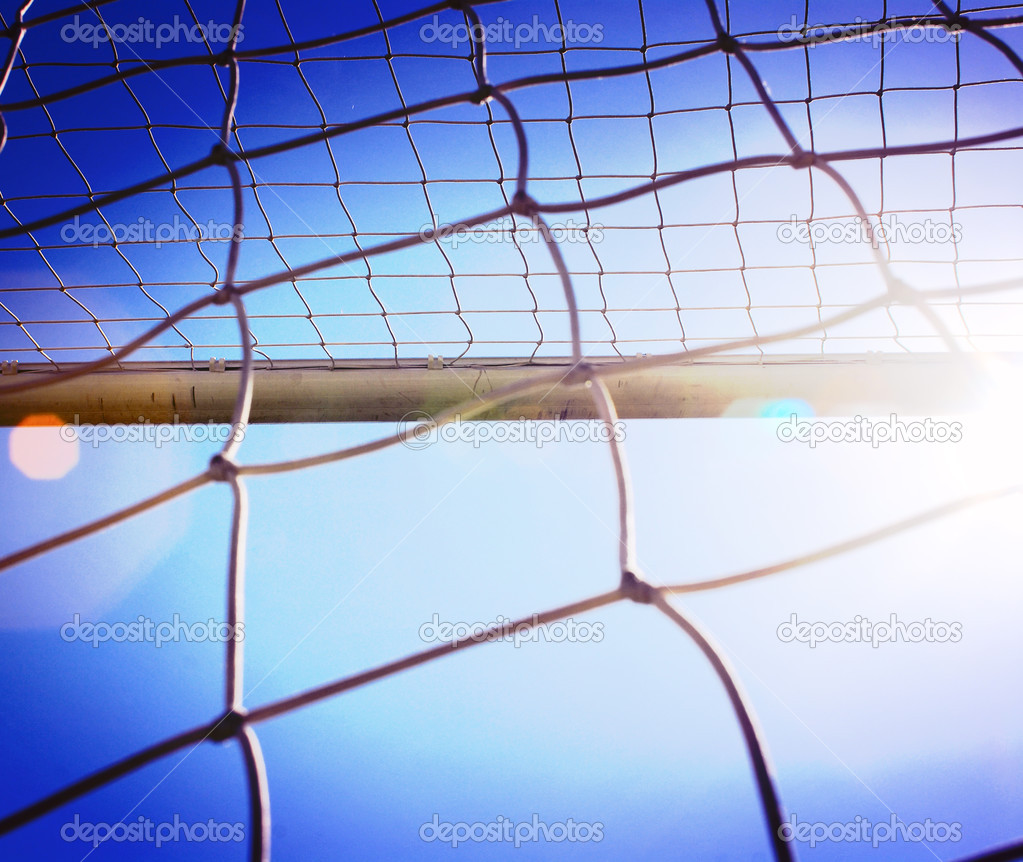 the soccer net with sun