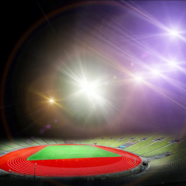 Stadion piłkarski z jasnymi światłami — Zdjęcie stockowe