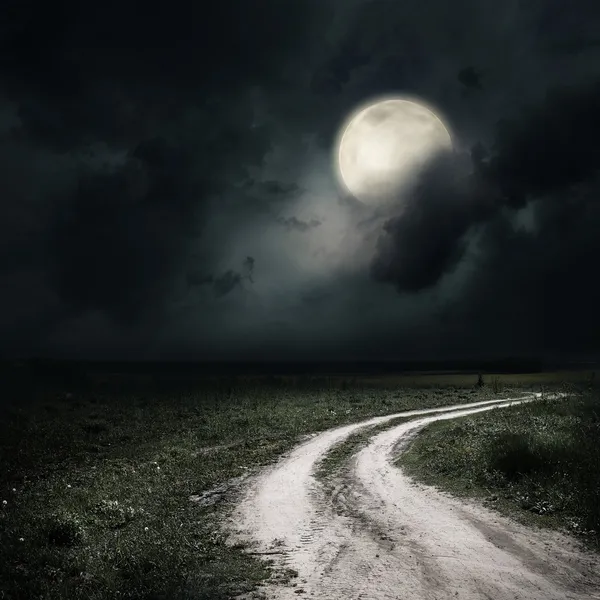 Moonrise over ground road — Stock Photo, Image