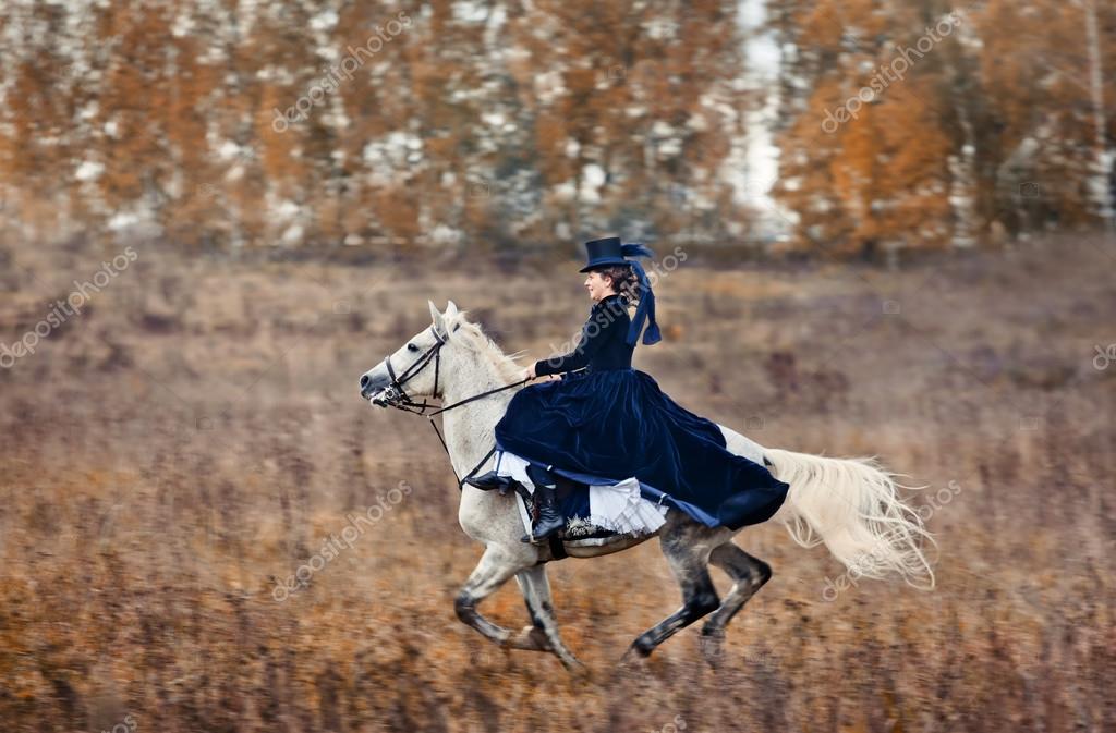 Horsehunting with ladies in riding habit Stock Editorial Photo