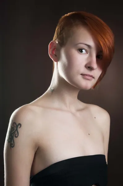 Woman with short red hair in black underwear — Stock Photo, Image