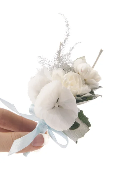 Witte bloemen in de hand — Stockfoto