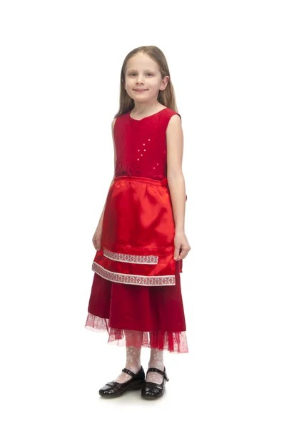 Klein schattig meisje in rode jurk — Stockfoto