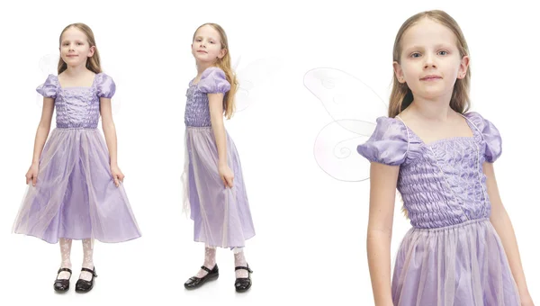 Kleines süßes Mädchen im lila Kleid — Stockfoto