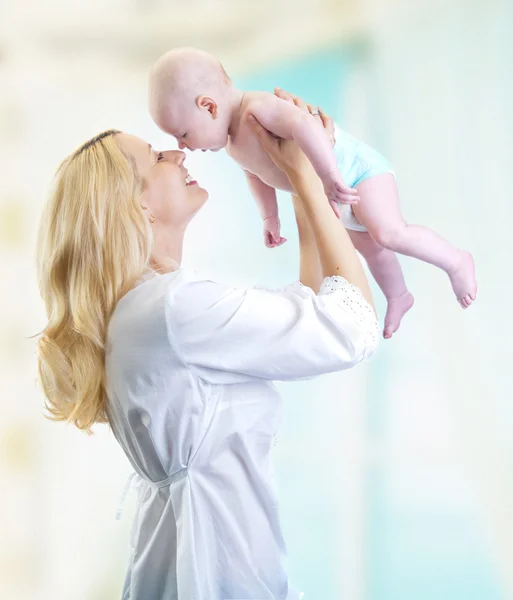 Happy mother hold baby in hands — Stock Photo, Image