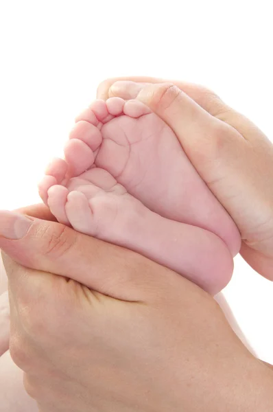 Mother holding her child's feet — Stock Photo, Image