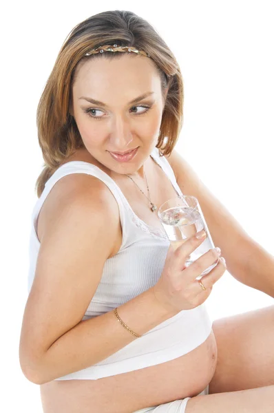 Pregnant woman with a glass of water — Stock Photo, Image