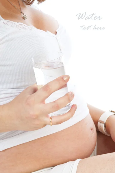 Pregnant woman with a glass of water — Stock Photo, Image
