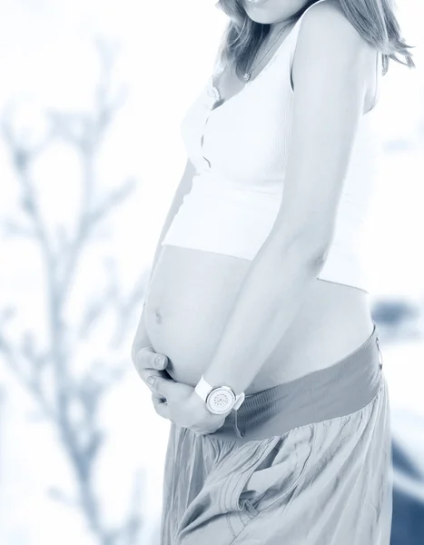 Pregnant woman touching her belly — Stock Photo, Image