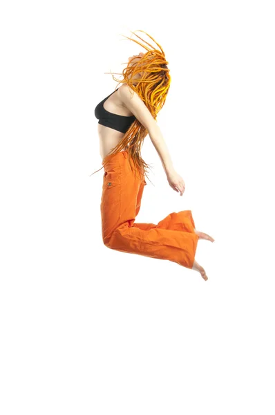 Beautiful girl with red dreadlocks jumping — Stock Photo, Image