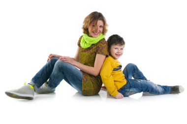 Mother and son sitting on a floor clipart