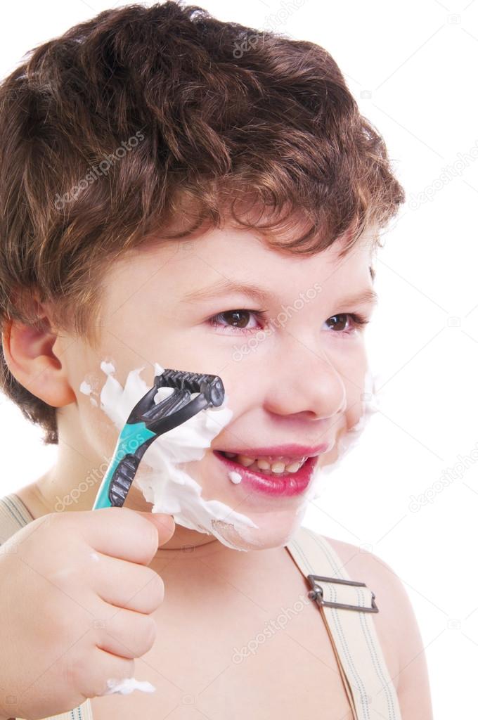 Adorable little boy shaving