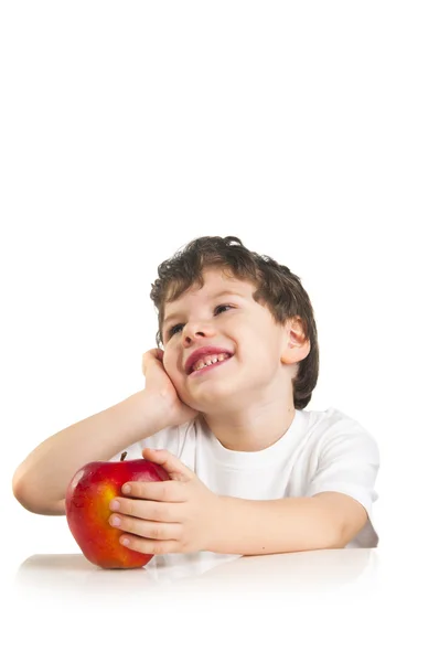 Smiling cute boy with a red apple — Stock Photo, Image