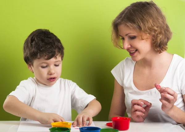 Happy mother and son painting — Stock Photo, Image