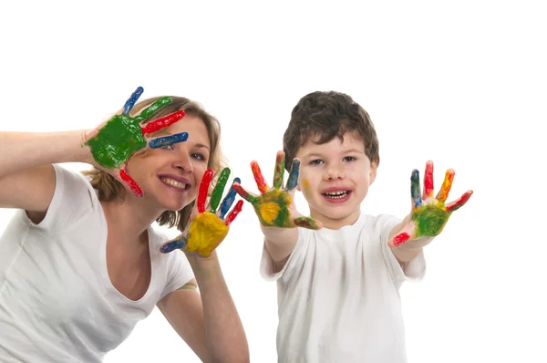 Mãe e bonito filho se divertindo com tintas — Fotografia de Stock