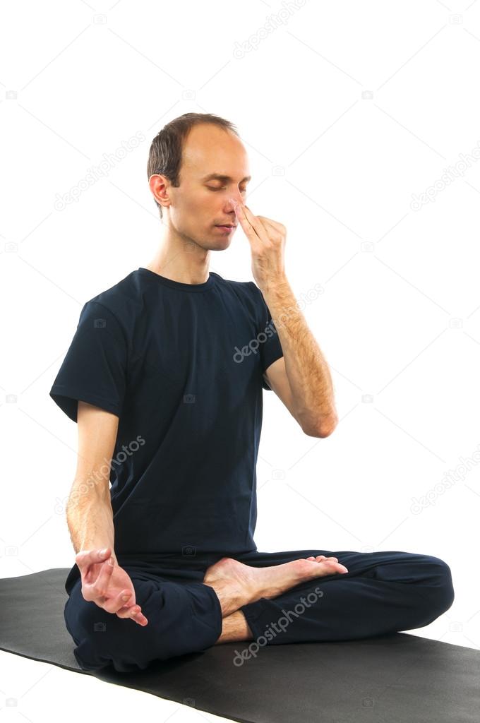 Man doing yoga Easy Pose with Nadi Shodhan Pranayama