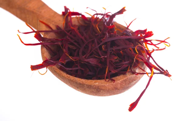 Handful of Saffron Spice in wooden spoon — Stock Photo, Image