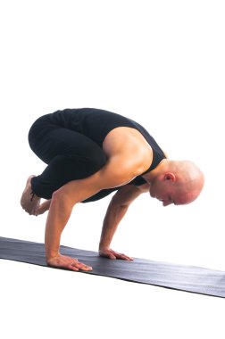 adam bakasana poz