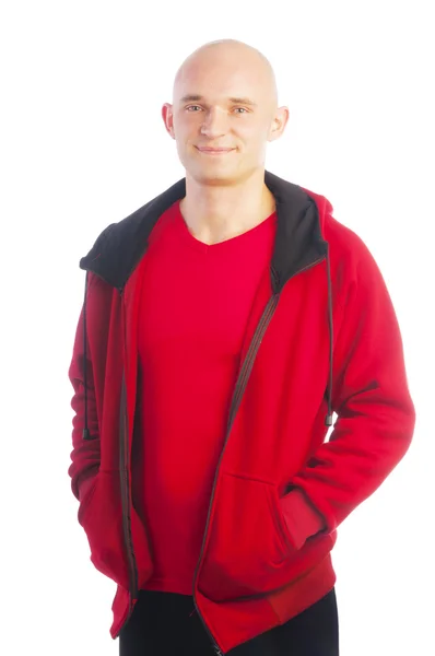 Spor kırmızı ceket holding adam eller cebe — Stok fotoğraf
