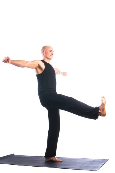 Man in Utthita hasta padasana pose — Stock Photo, Image