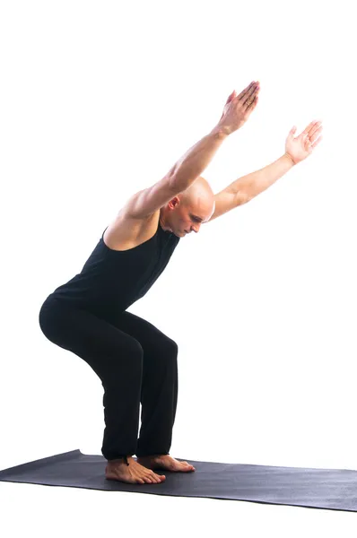 Man in Ardha Utkatasana yoga position — Stock Photo, Image