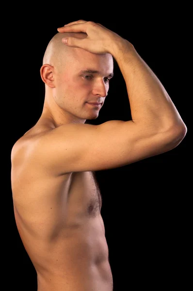 Muscular man with hand on his head — Stock Photo, Image