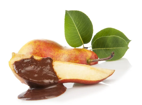 Pear with chocolate and green leaves — Stock Photo, Image