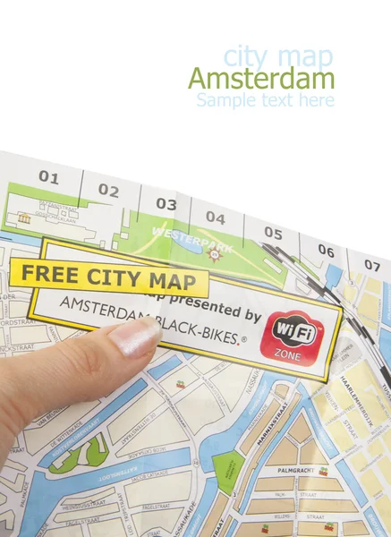 Tourist holding Amsterdam City map — Stock Photo, Image