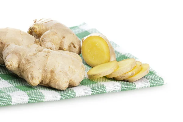 Sliced ginger roots on the checkered serviette — Stock Photo, Image