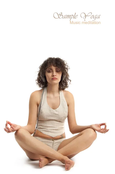 Woman meditating with music in headphones — Stock Photo, Image
