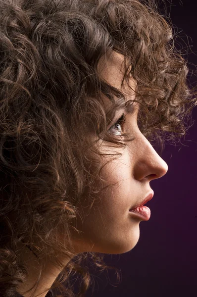 Young beautiful woman with curly hair Stock Photo