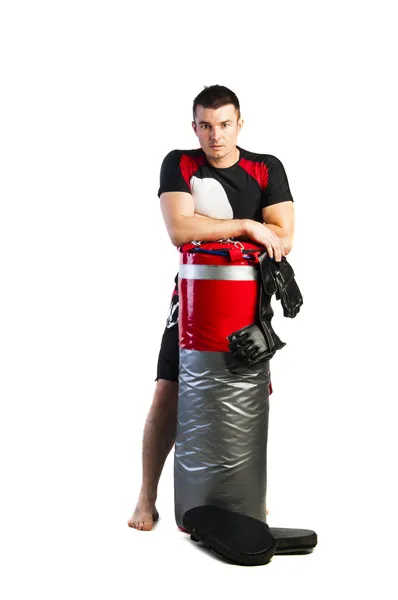 Mladý boxer s boxovací pytel — Stock fotografie
