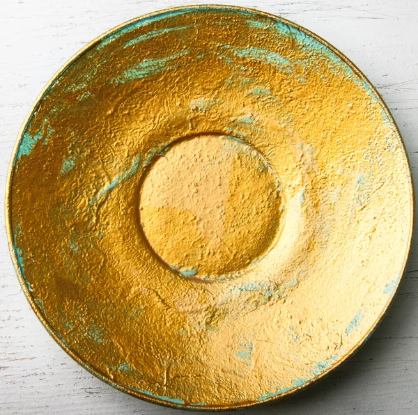 Golden painted decorative plate — Stock Photo, Image