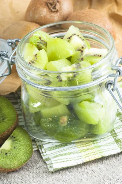 Kiwi in glass jar — Stock Photo, Image