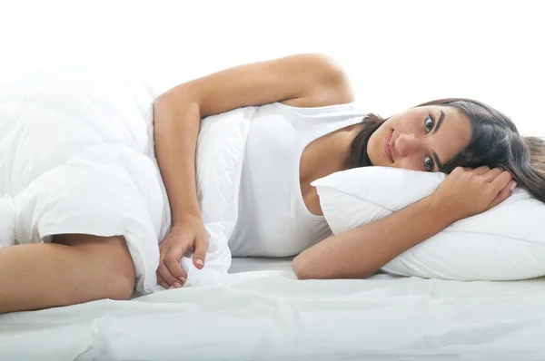 Young woman lying on bed — Stock Photo, Image
