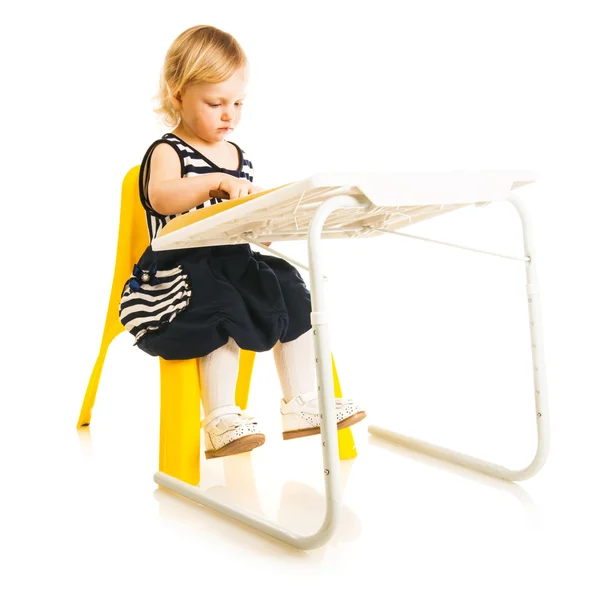 Baby girl at the desk — Stock Photo, Image