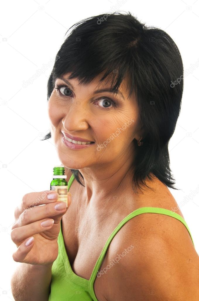 Mature woman with essential oil