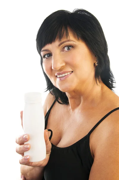 Mature woman with yogurt — Stock Photo, Image