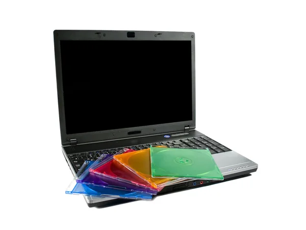Farvet cd på en bærbar computer - Stock-foto