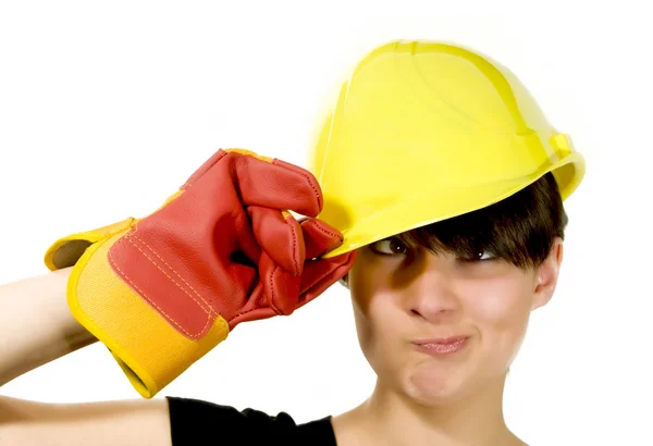 Girl in yellow hard hat and red gloves with funny face — Stock Photo, Image